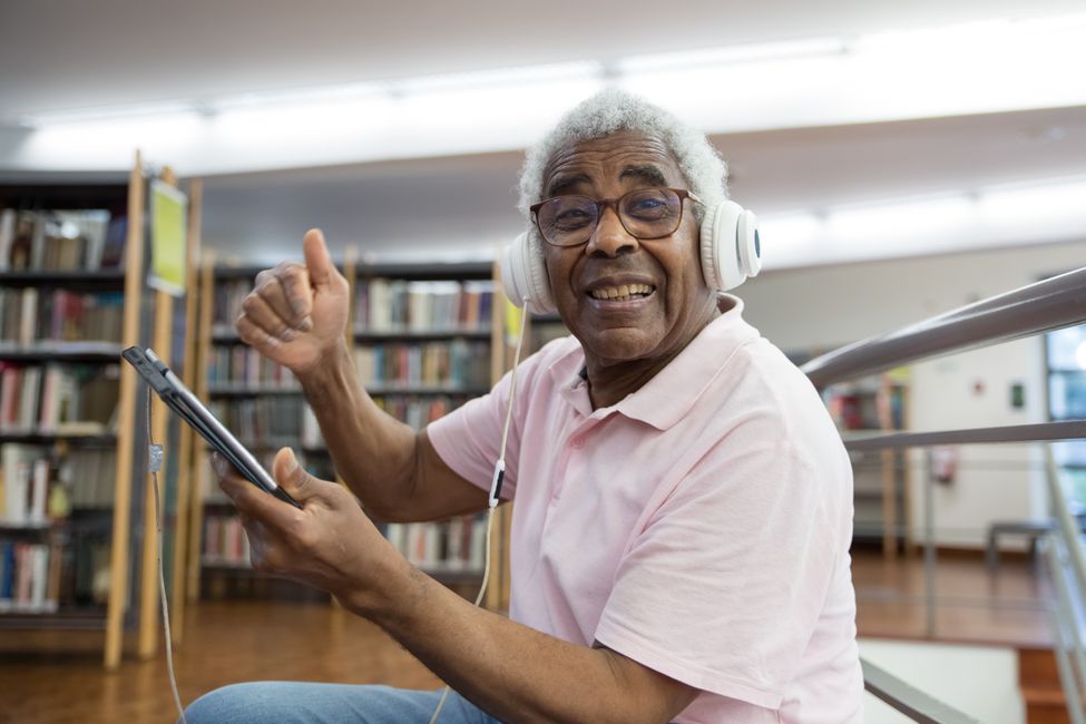 Older adult wearing headphones peacefully