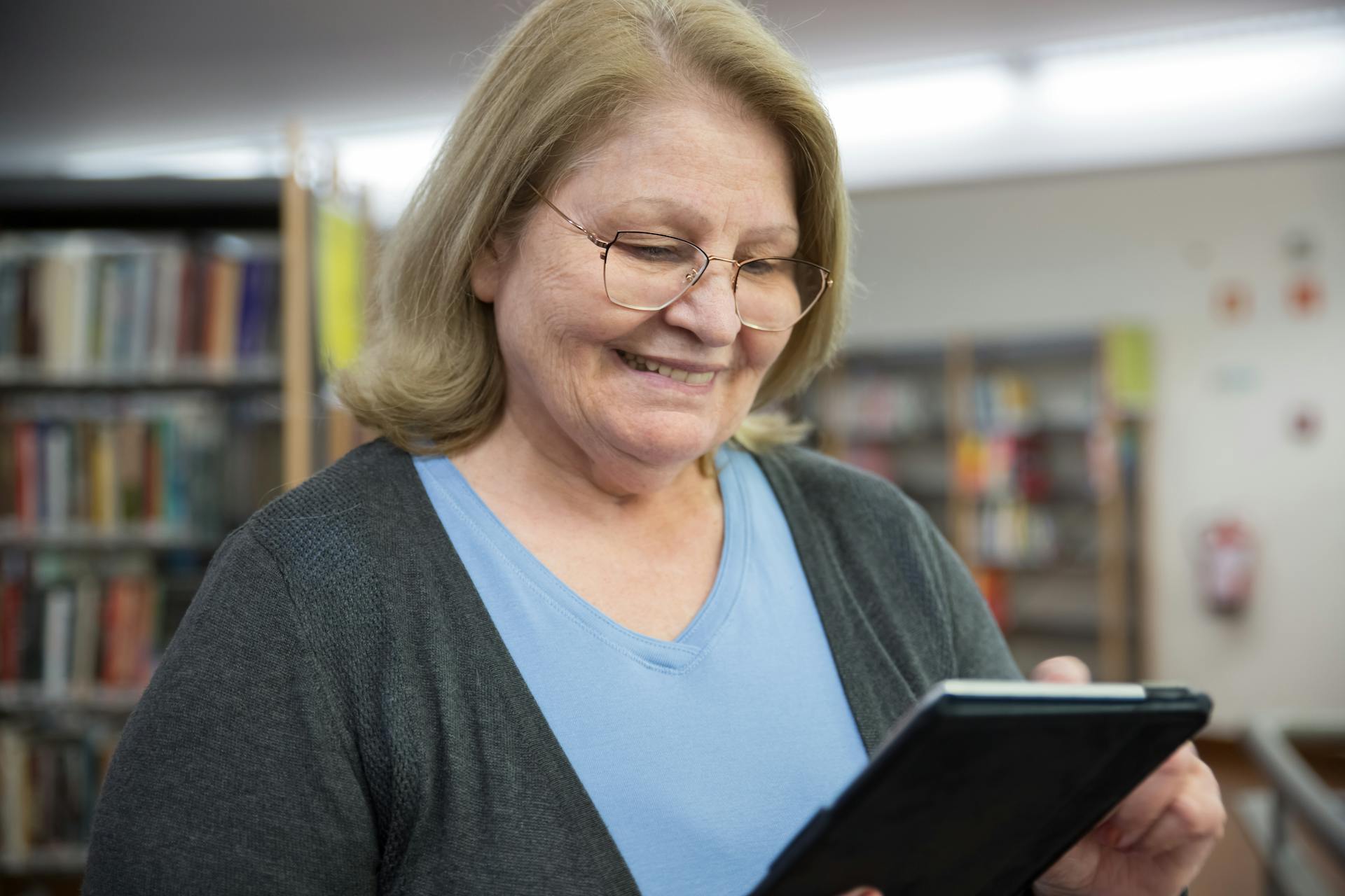 Close Up Photo of Woman Using a Tablet