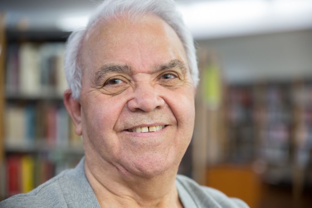 A smiling older man, happy and proud of his recovery progress