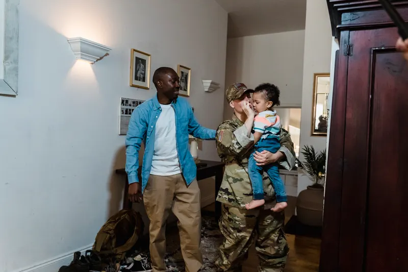 Military family arriving at a new home — illustrating pcs from naval station mayport to hampton roads
