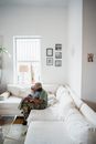 A Father and Child Sitting on the Sofa