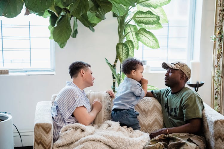 Beautiful Family Sitting On A Couch