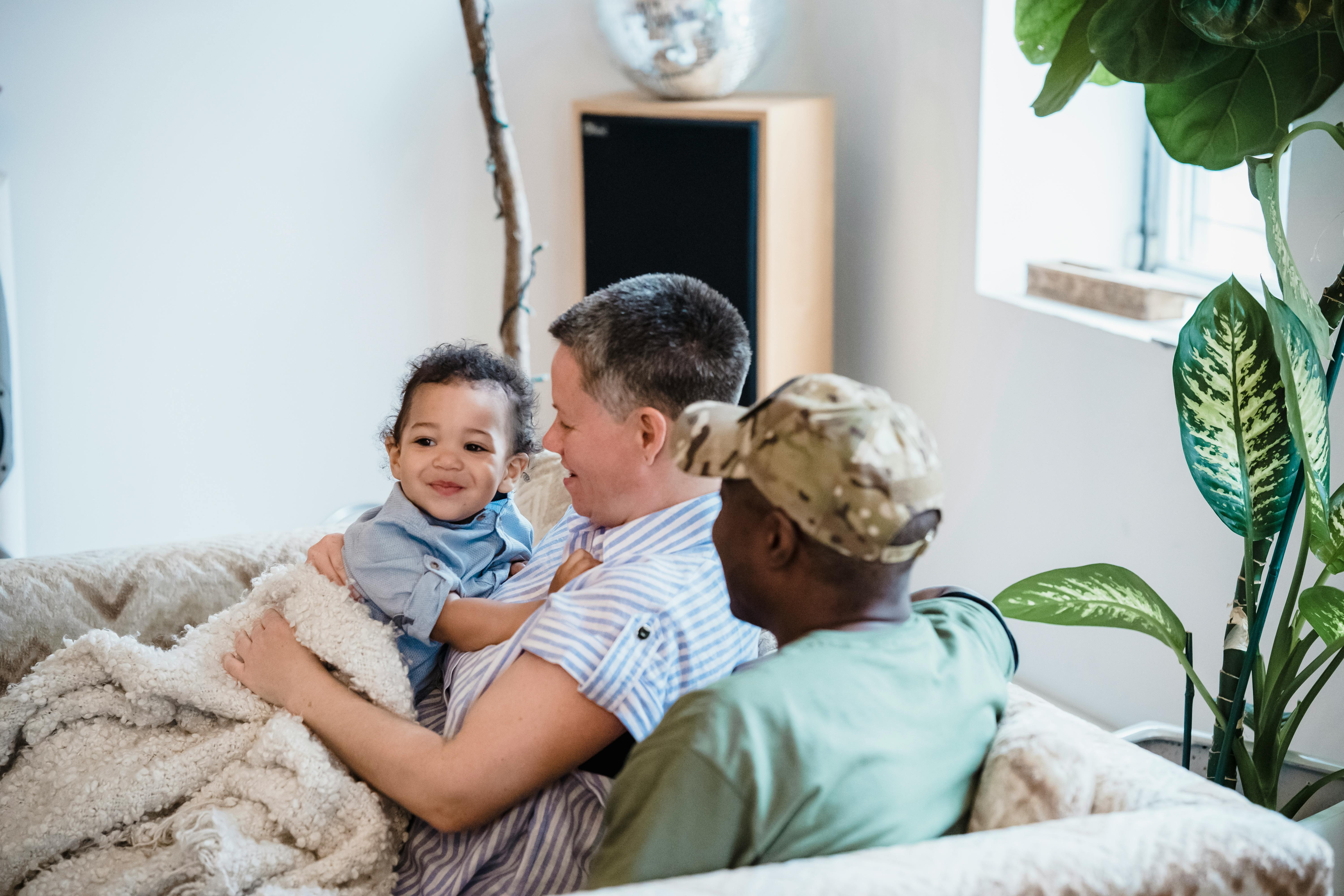 family relaxing comfortably in modern living room - Financing 