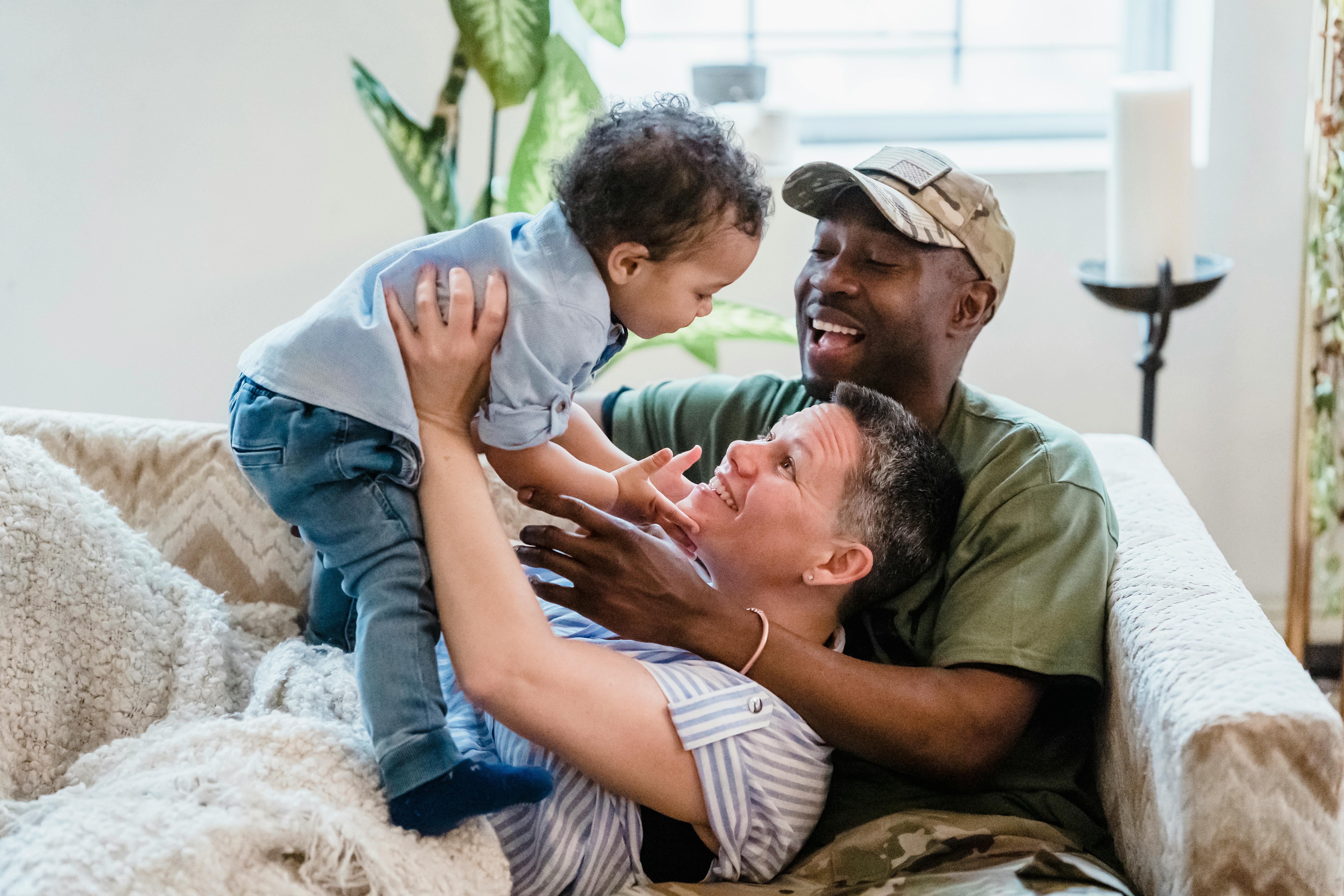 A Family Sitting On The Couch Free Stock Photo   Pexels Photo 7984304 