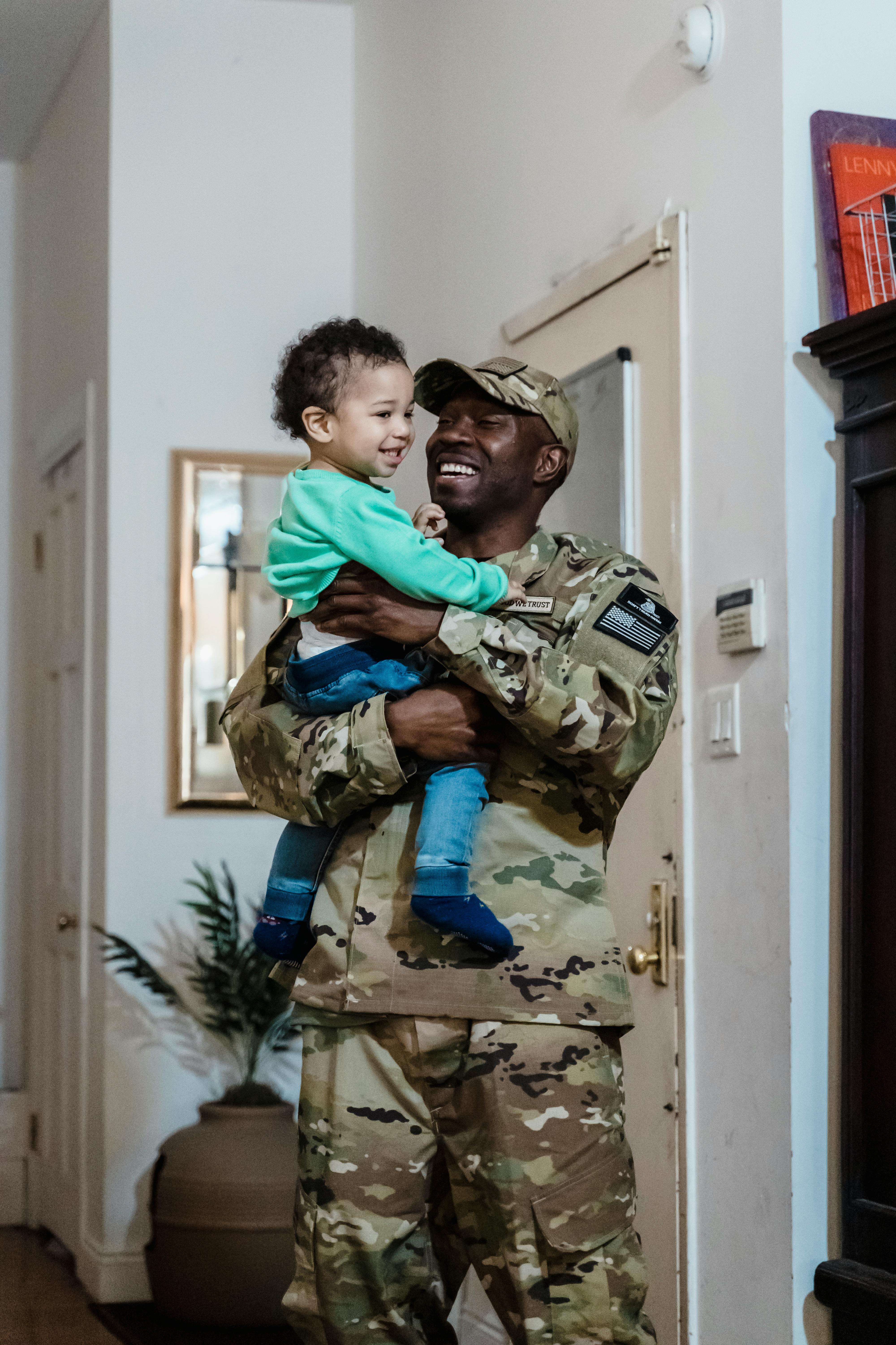 a man carrying his child