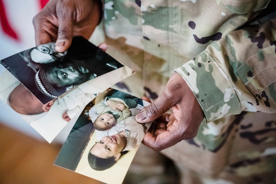 Family members looking at a photo of a loved one