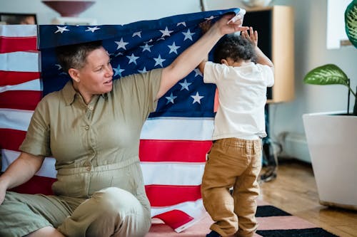 A Woman Holding an American Flag