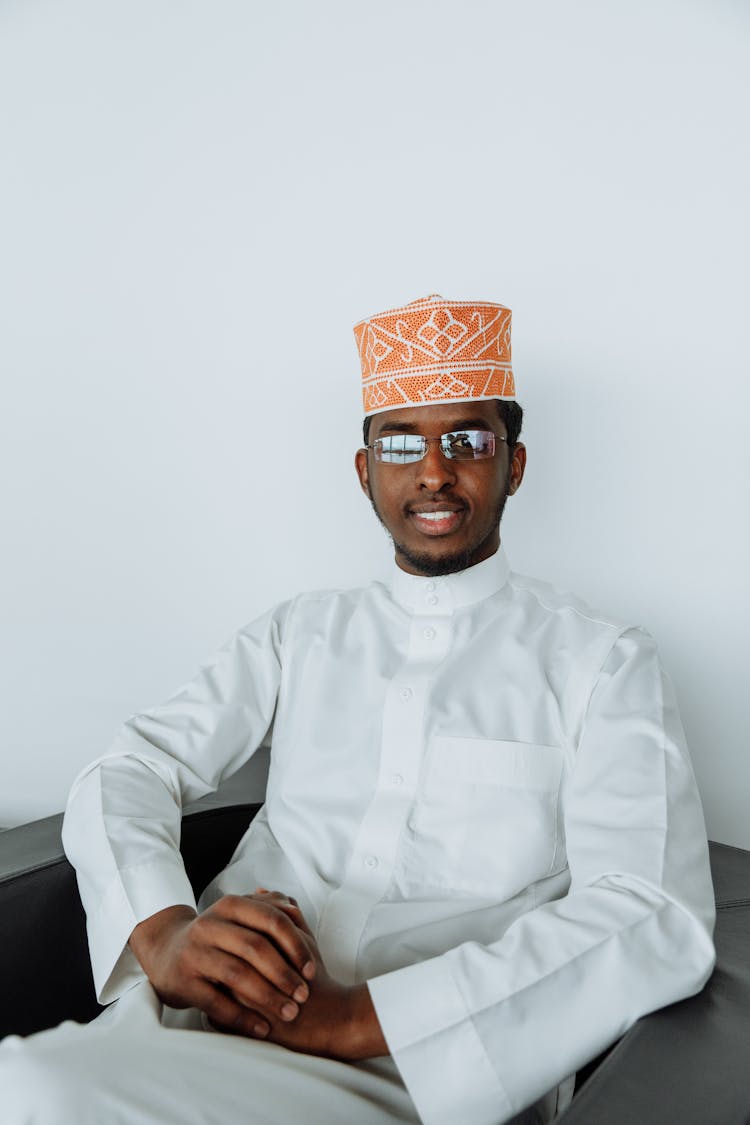 Smiling Man Wearing A White Thobe