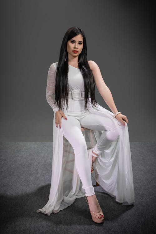 Woman in White Long Sleeve Dress Pants