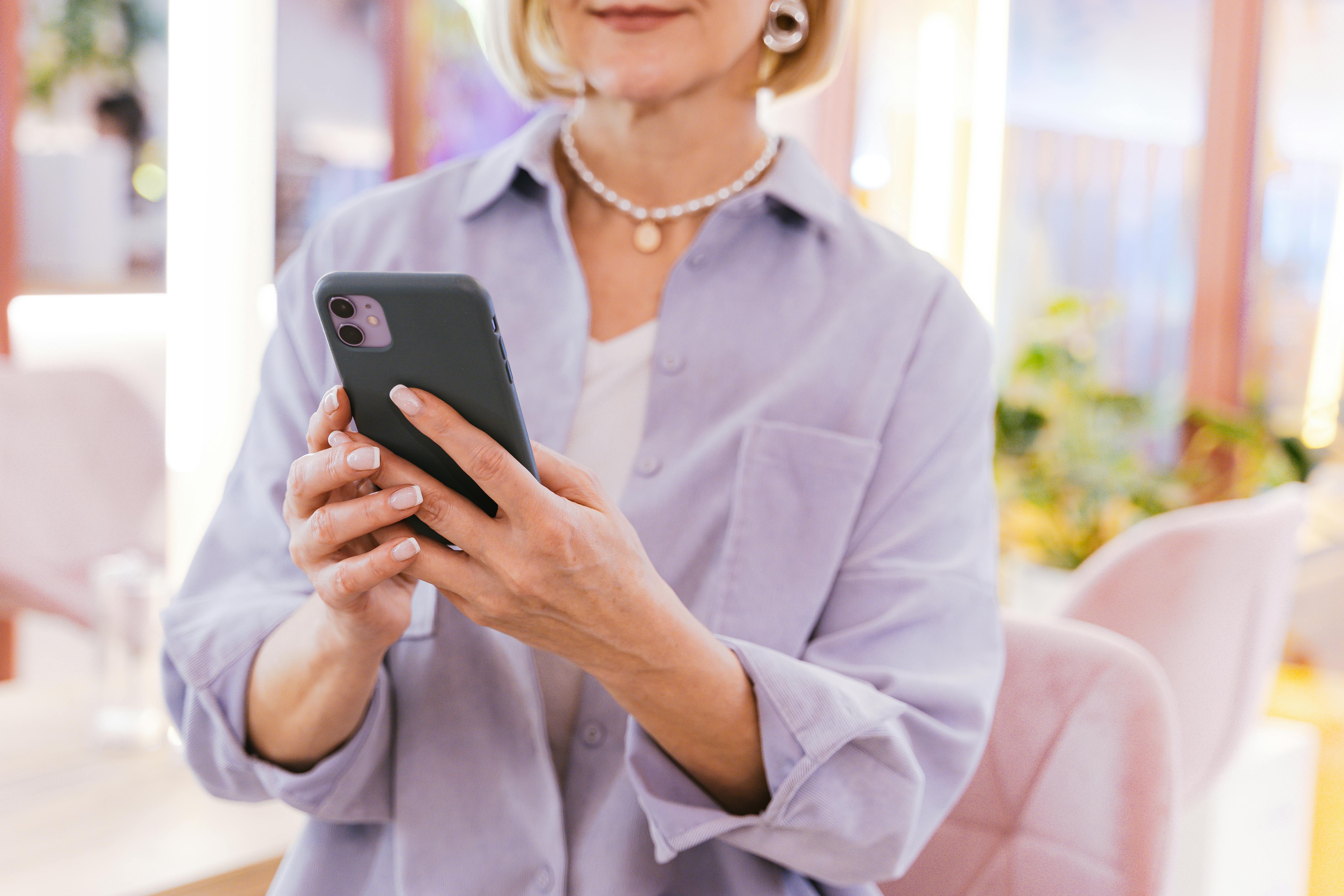 close up shot of a person using a mobile phone