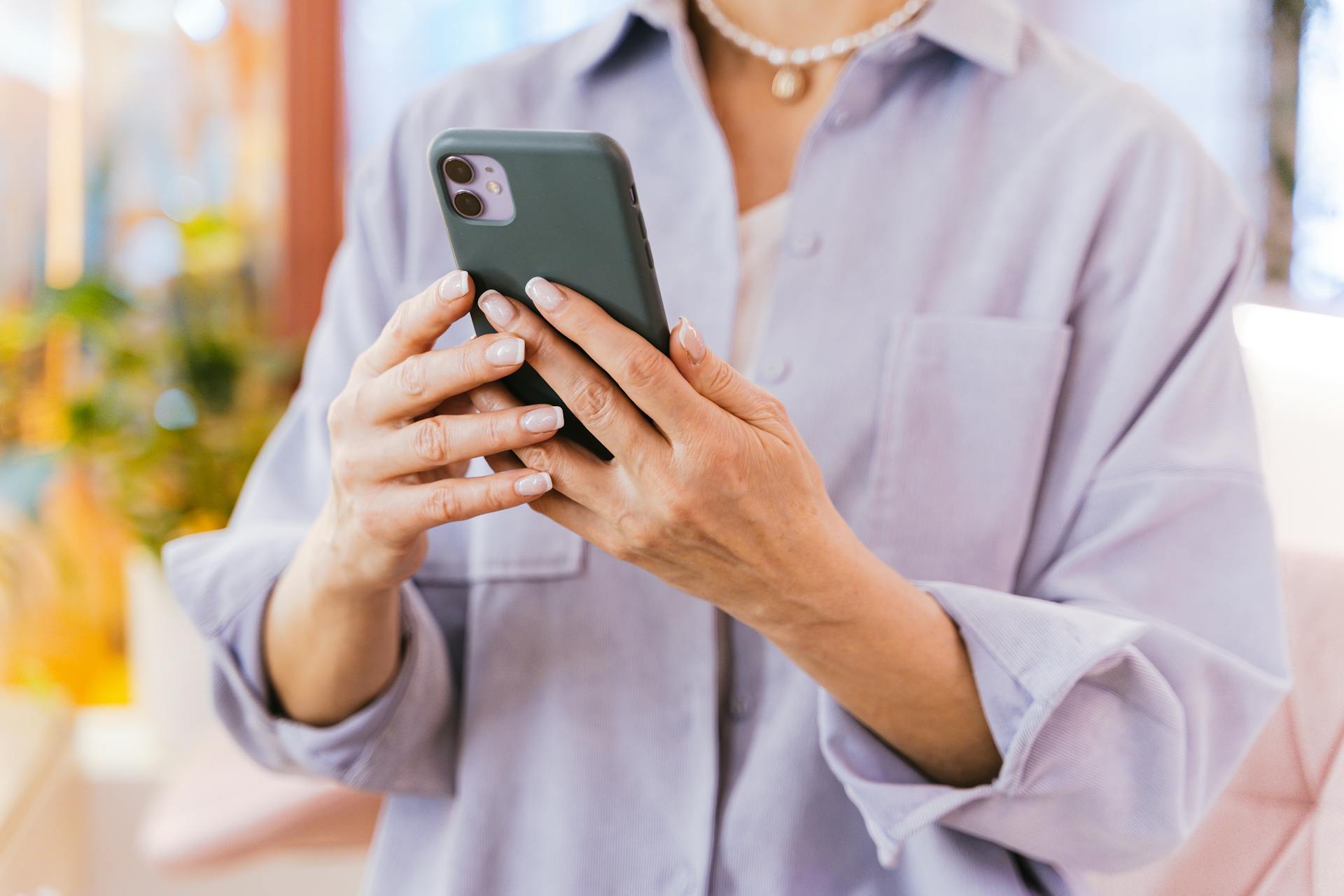 Close-Up Shot of a Person Using a Mobile Phone