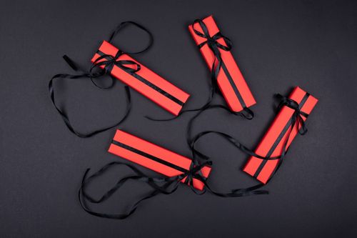 Free Top view of red gift boxes with black ribbons on a black background, perfect for holidays. Stock Photo