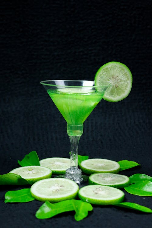 Green Cocktail Drink with Sliced Lime