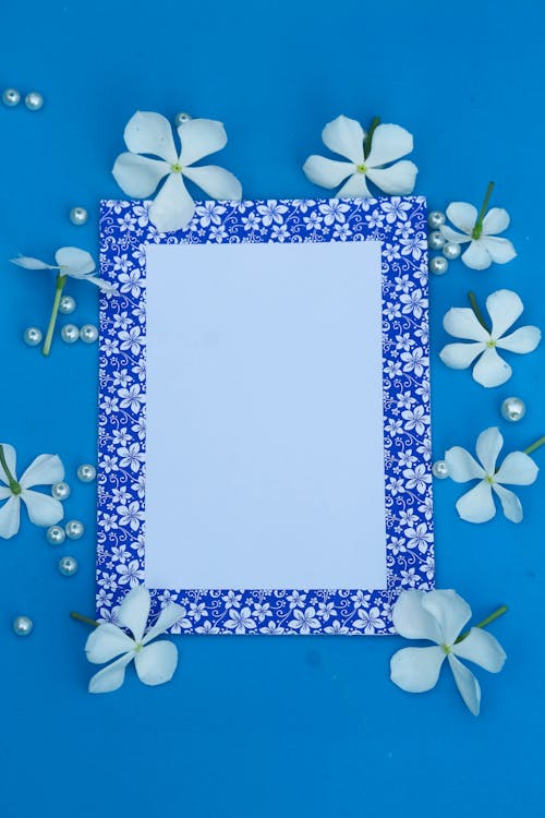 White Blank Paper on Blue Background