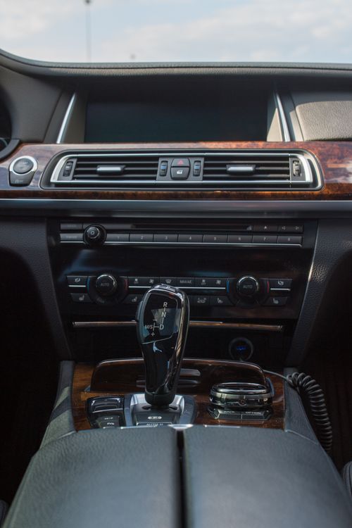 Free Explore the elegance of a luxury car interior highlighting a sleek dashboard and gear stick. Stock Photo