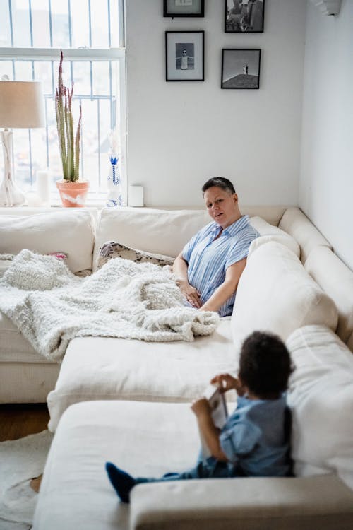 Free Woman and Child on Sofa Stock Photo