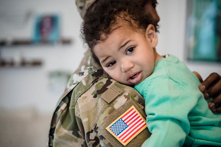 Toddler Leaning On The Man's Shoulder