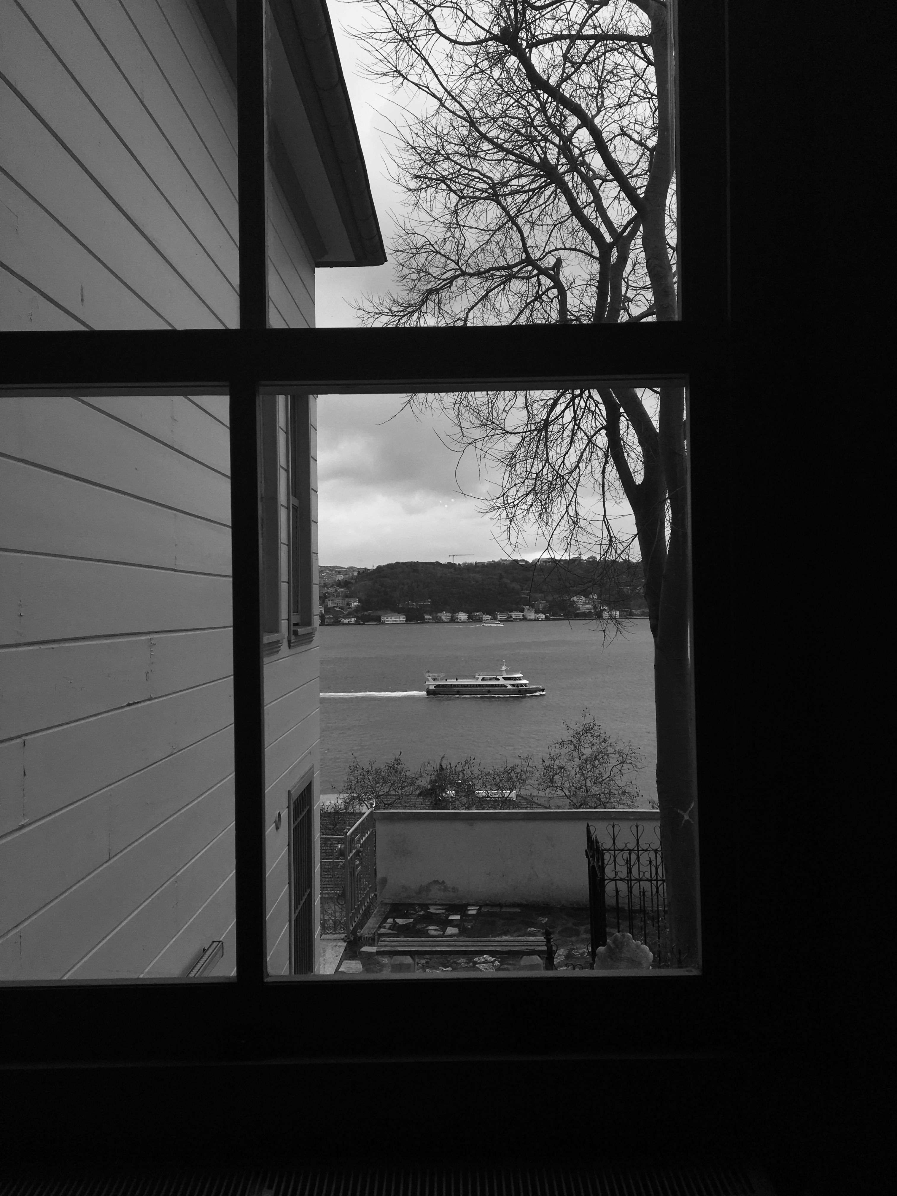 Grayscale Photo of a Window · Free Stock Photo