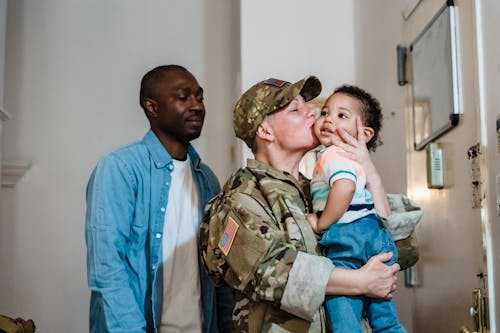 Person Kissing a Little Boy