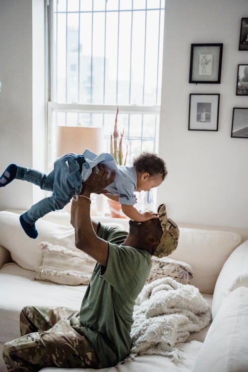 Free Man Playing with his Child Stock Photo