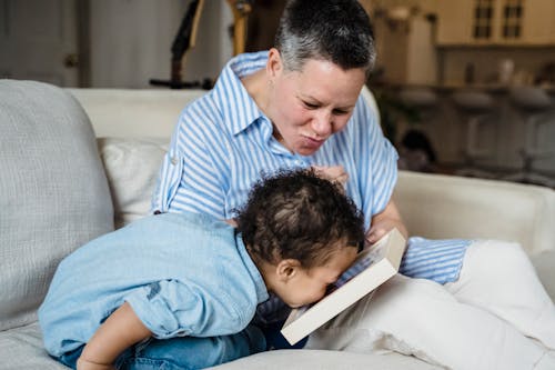 Free Little Boy Kissing a Picture Stock Photo