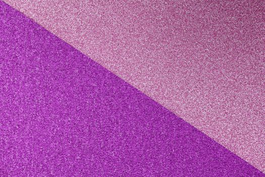 A vibrant and glittery abstract texture with purple and pink colors, perfect for backgrounds.