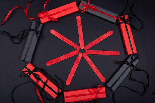 Red and black gift boxes arranged in a circle for Black Friday promotion.