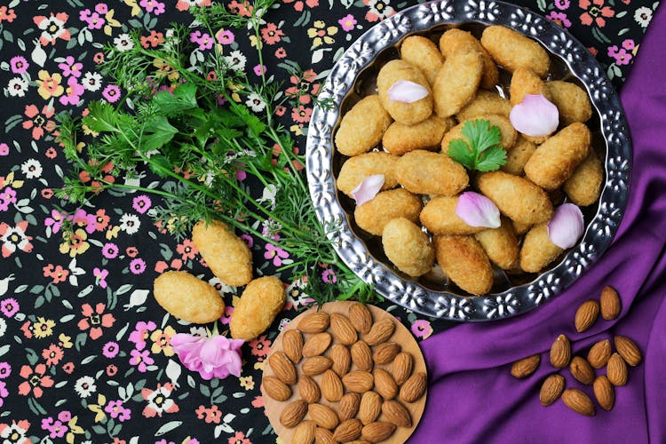  Paneer Pakora On Colorful Tablecloth With Almonds And Parsley