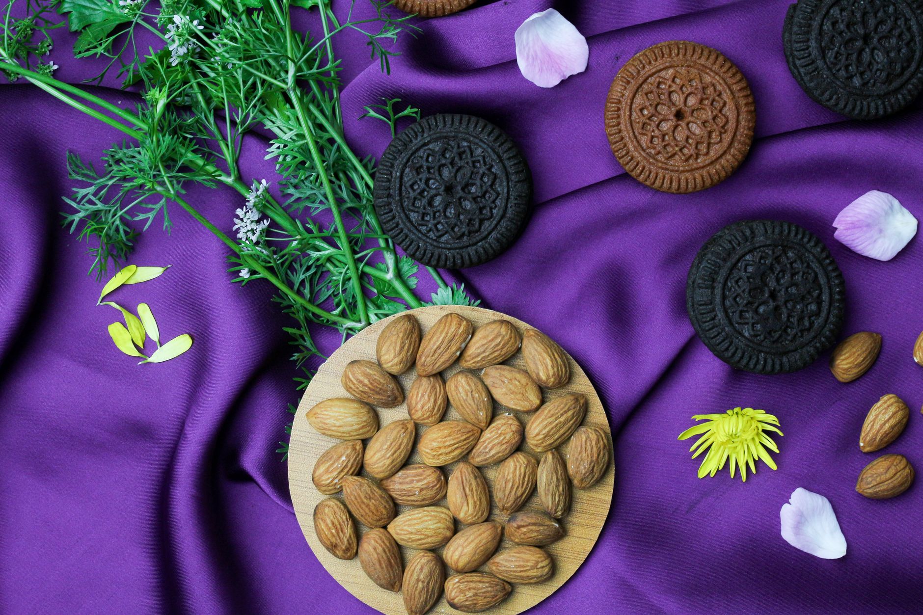 Stack of almond thin biscuits on a rustic wooden table
