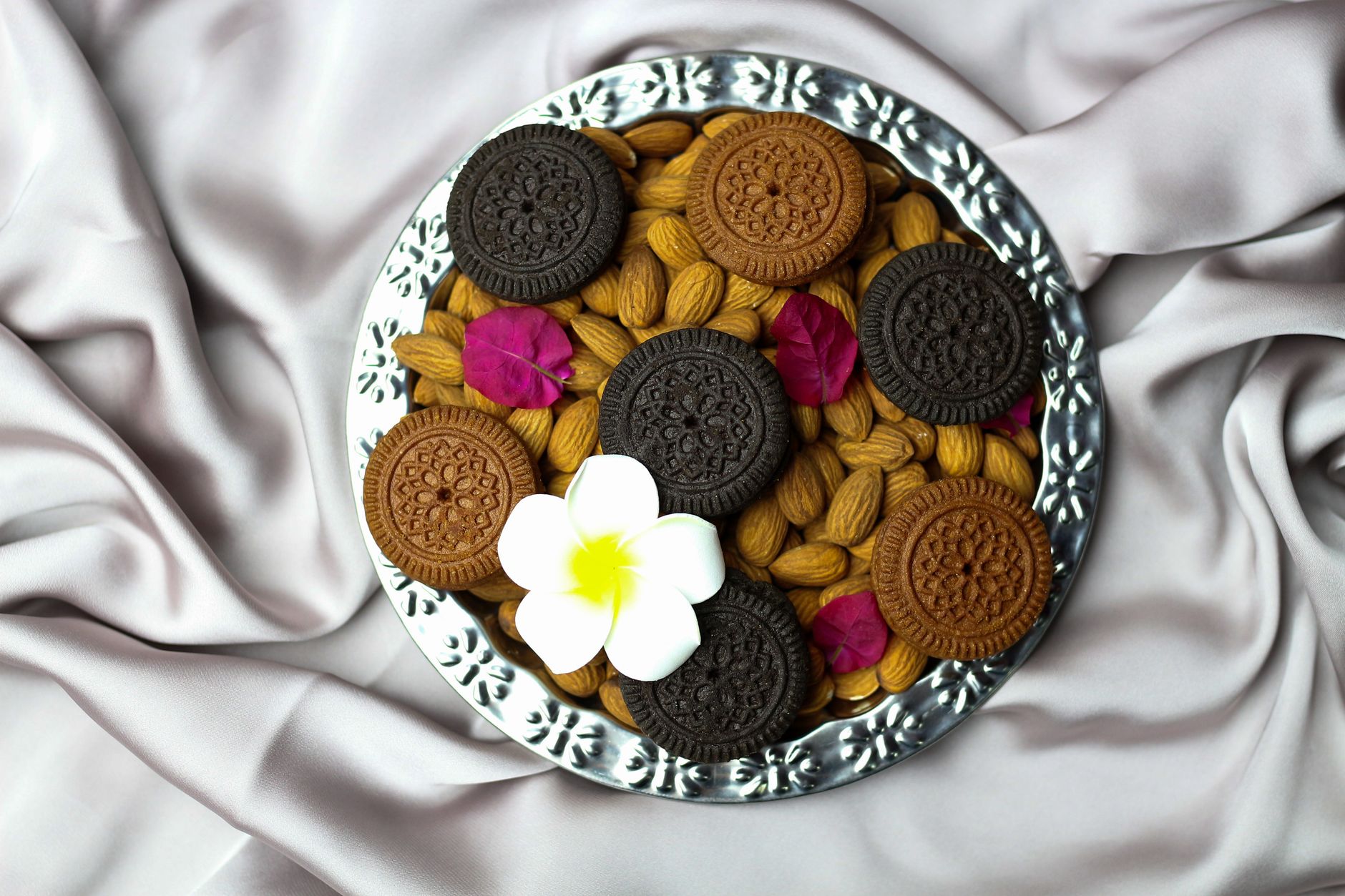 Freshly baked Chinese almond biscuits cooling on a rack with golden edges