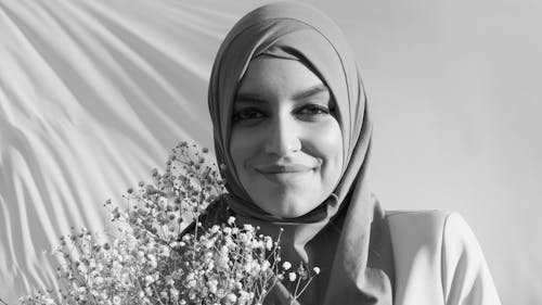 Grayscale Photo of a Woman Wearing Hijab