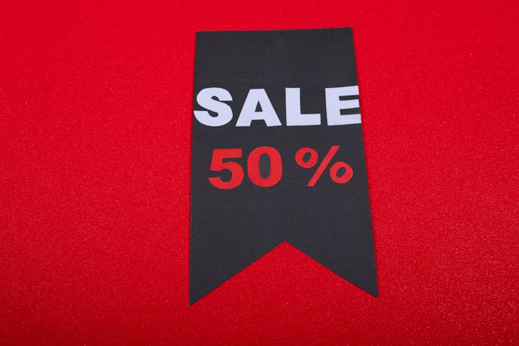 Black Sale Poster On Red Background