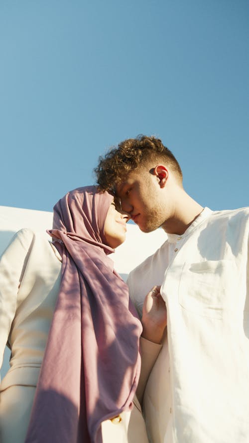 Low Angle Shot of a Couple Looking at Each Other