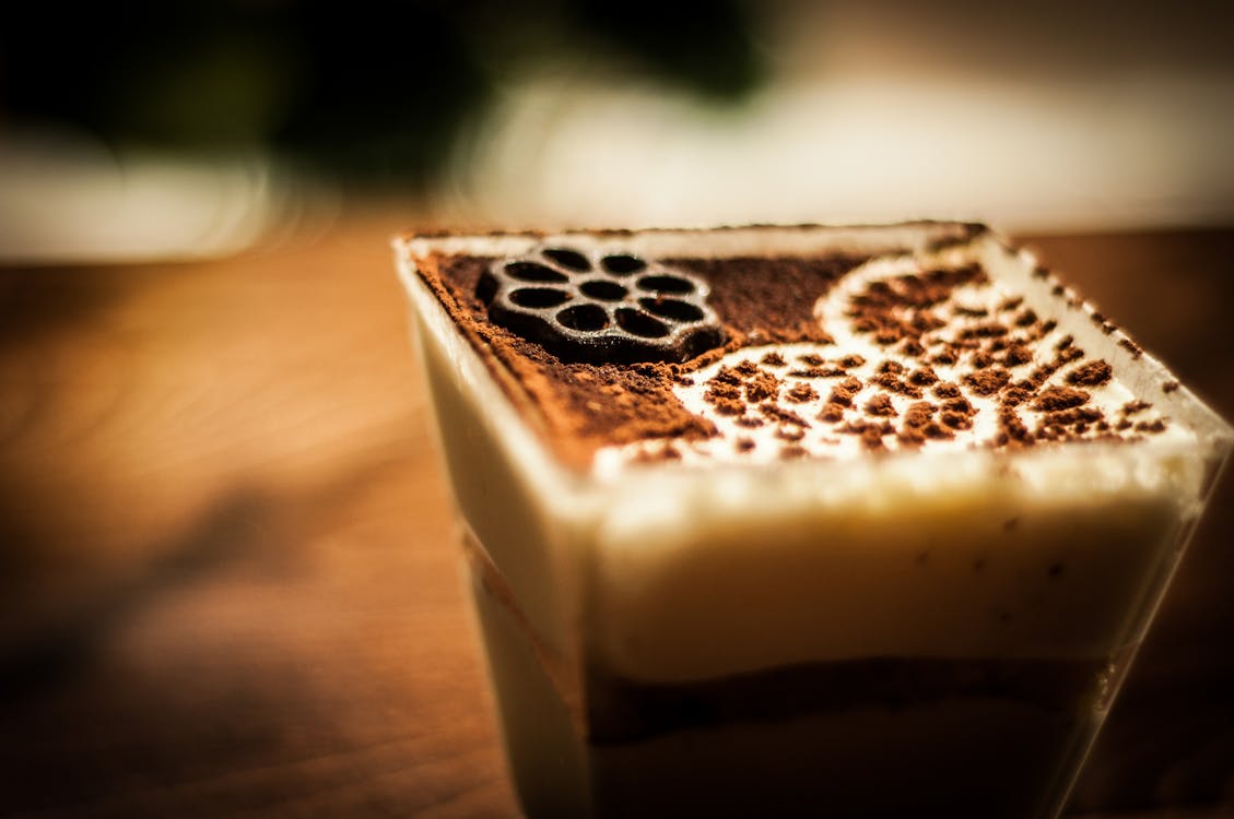 Free Coffee Latte With Cookie on Top Stock Photo