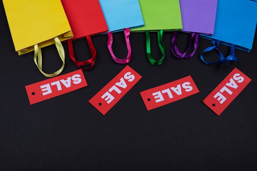 Vibrant shopping bags with bright red sale tags on a dark background, ideal for retail promotions.