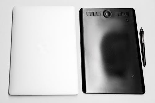 Free Black Drawing Tablet on a White Surface Stock Photo