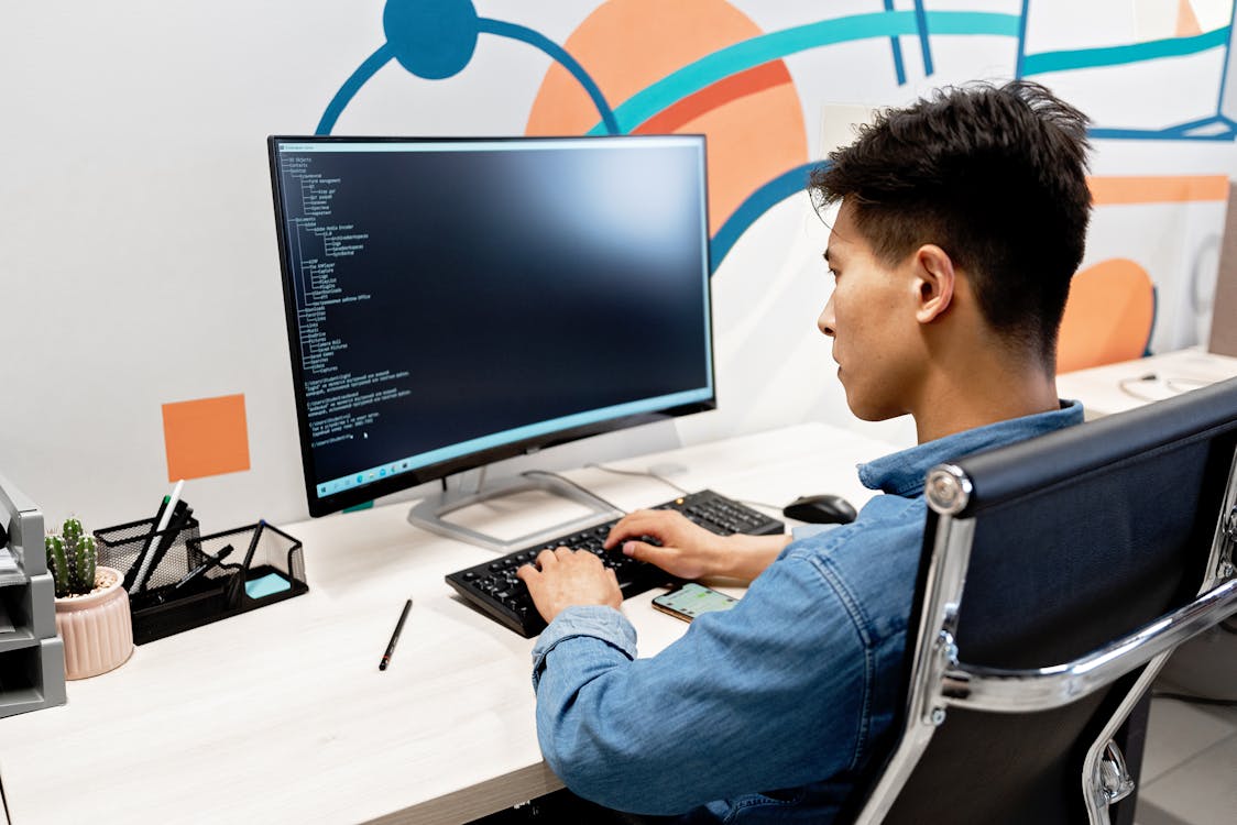 A Man using Computer Office