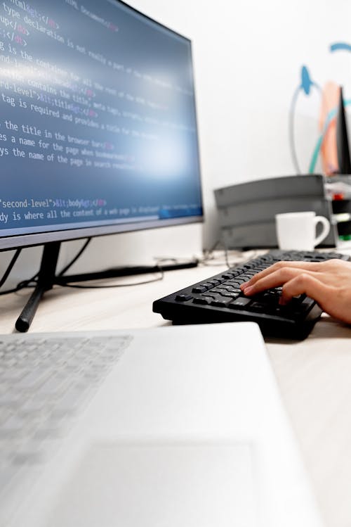 A Person Holding a Black Keyboard