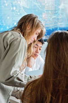 Diverse group of young professionals working collaboratively in a modern office setting.