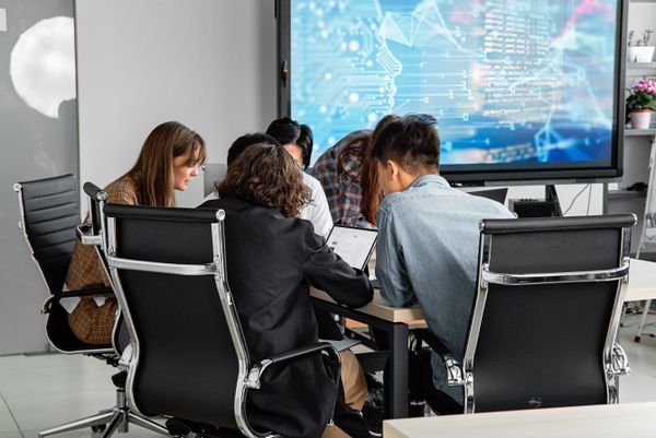 Cybersecurity professionals collaborating in modern workspace
