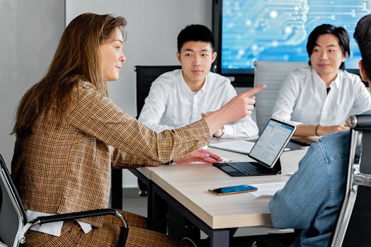Professional team engaged in collaborative discussion in a modern office setting.