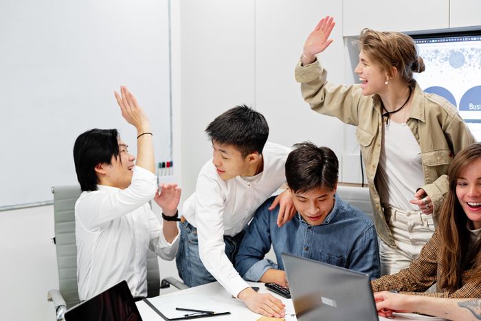 Colleagues helping each other