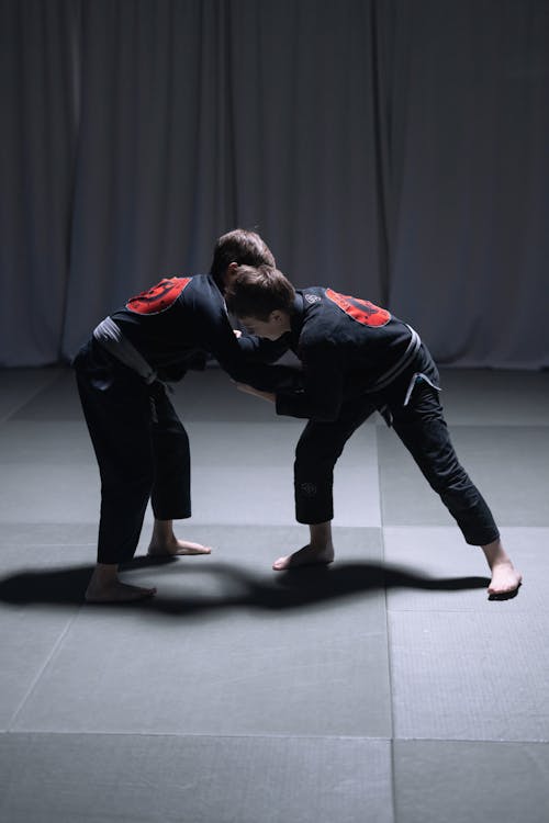 Free Men Sparring on the Mat Stock Photo