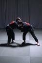 Men Sparring on the Mat