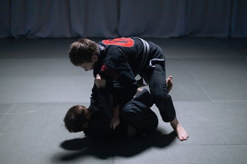 Free 2 Boys Sparring on the Mat Stock Photo