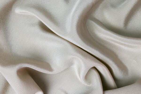 Rippled cream silk fabric — photo by Tamanna Rumee on Pexels