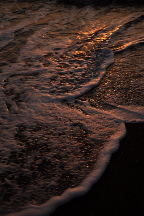 Sea Foam Formations on the Beach Shore 