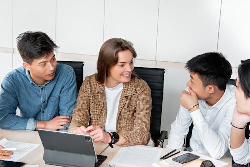Free People Having Conversion Together in the Office Stock Photo
