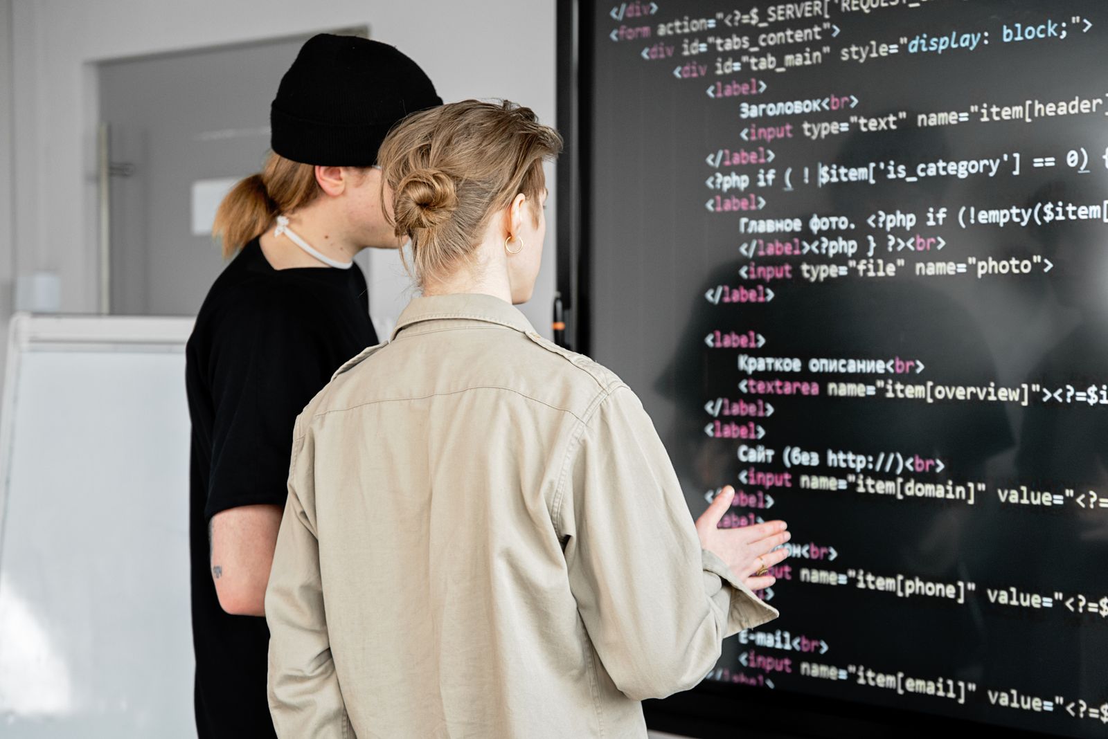 Developers reviewing interface and application code together
