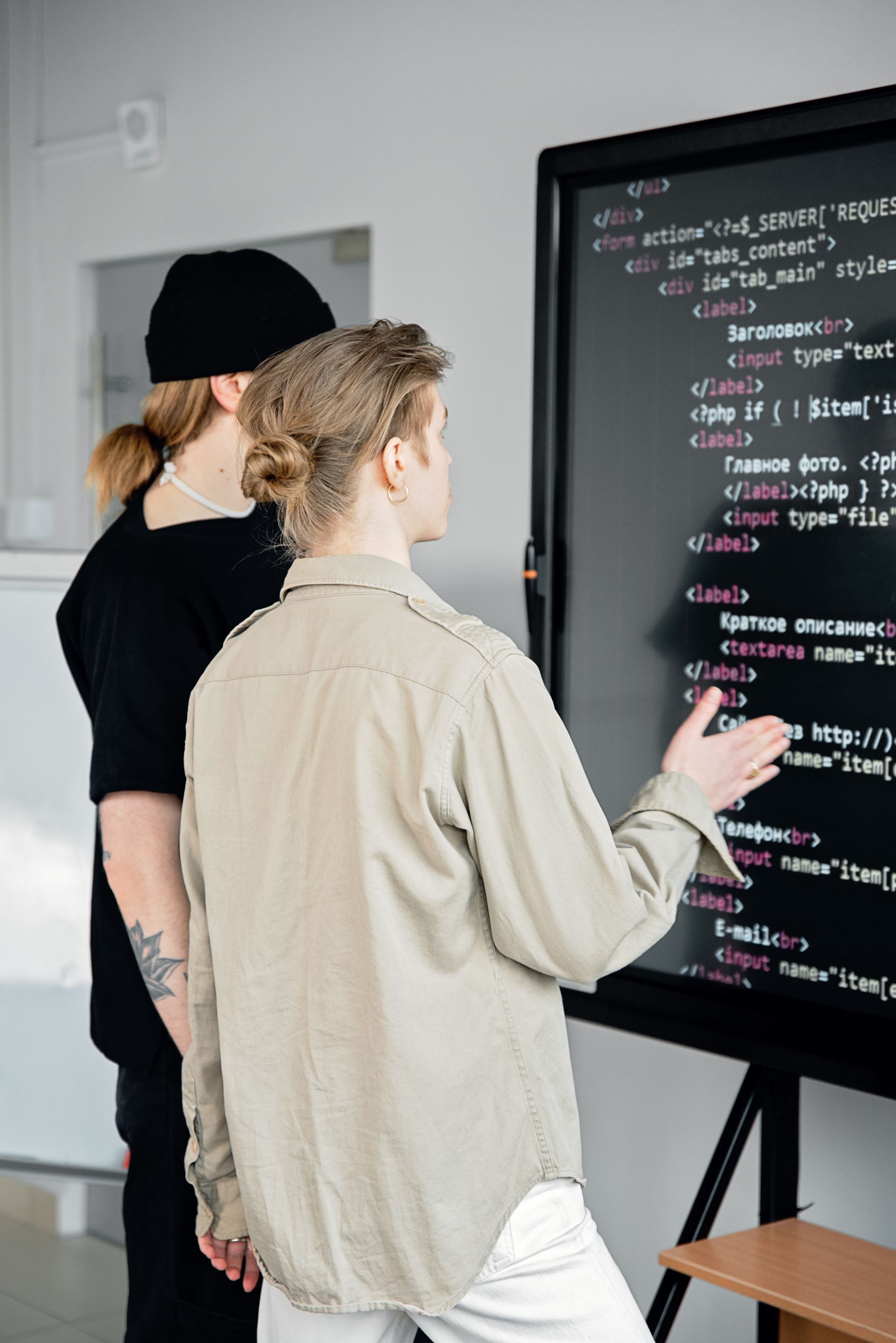 Developers reviewing programming work together